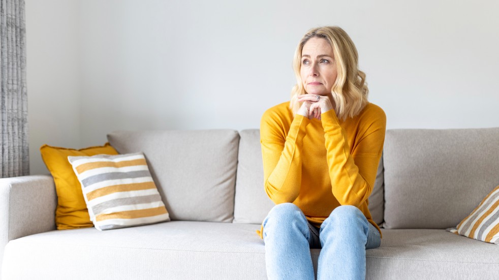 woman lonely on sofa